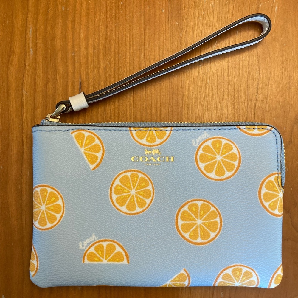 Coach orange print wristlet 🍊